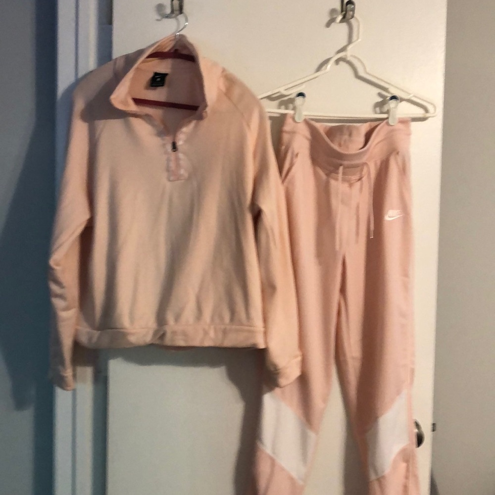 Pink Nike jogging suit.